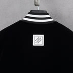 Black jacket with ribbed striped collar and square Louis Vuitton back label