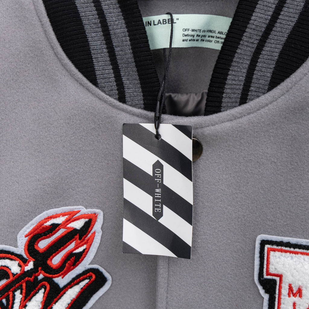 Off White varsity jacket neckline with black striped ribbing and OFF-WHITE hang tag