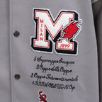 Off White varsity jacket front close-up of large M logo with red animal head and text