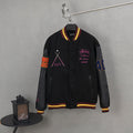 Black varsity jacket with ribbed striped collar, button front, and colorful front graphics
