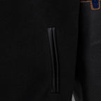 Black jacket side pocket opening detail