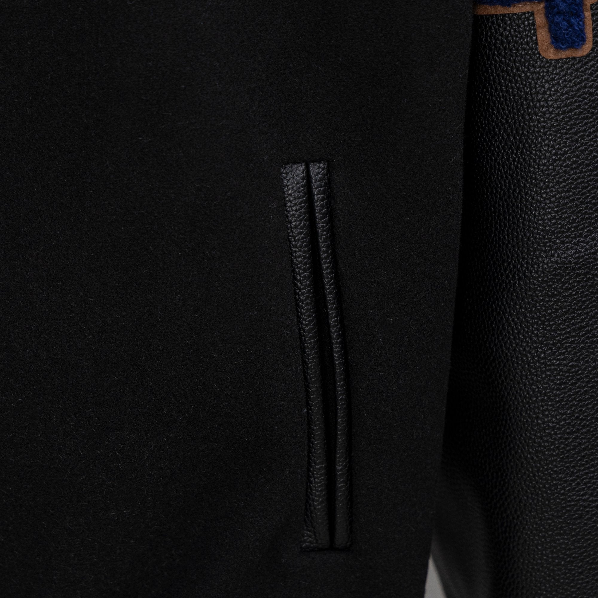 Black jacket side pocket opening detail