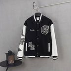Givenchy button-up jacket in black with white sleeves and front appliqué patches