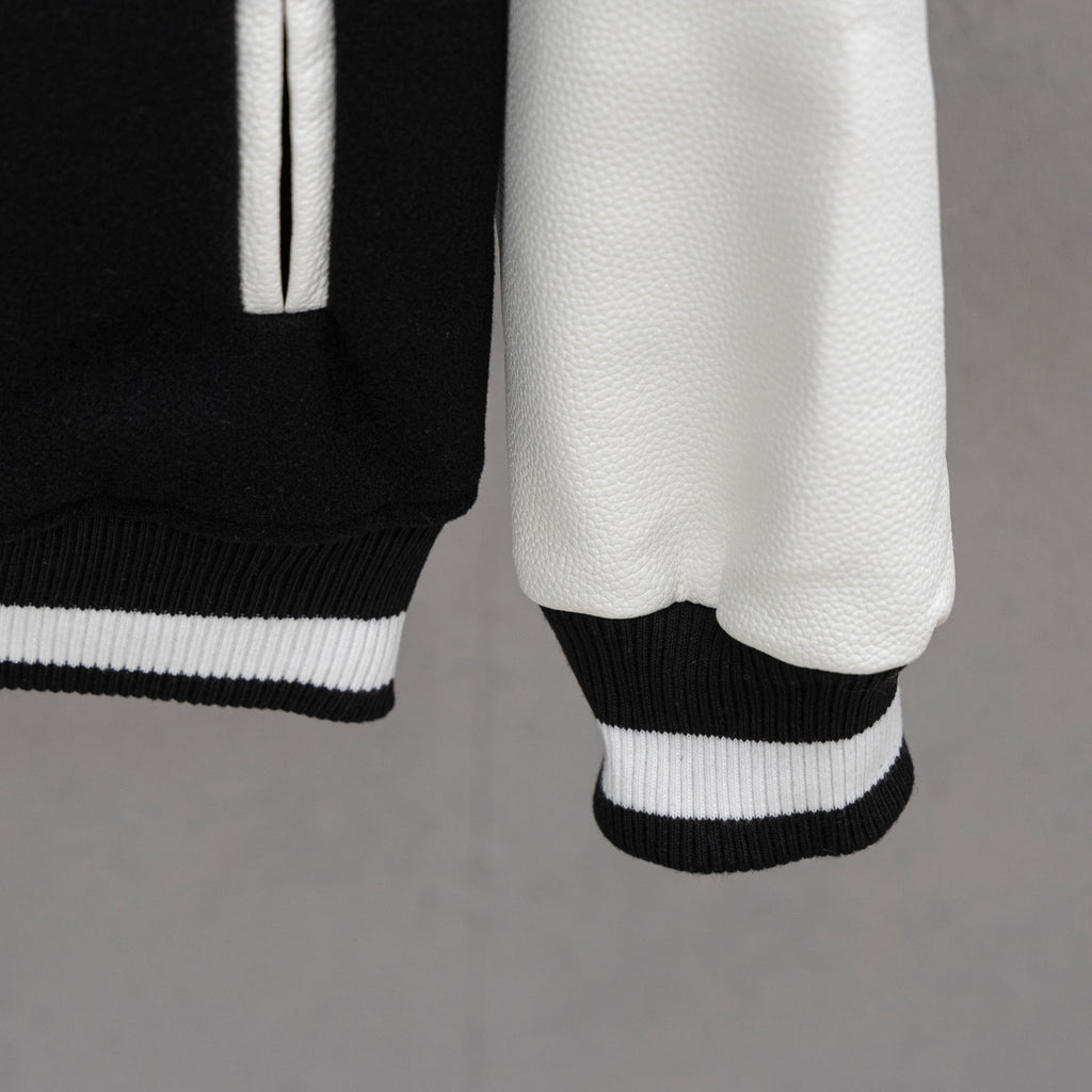 Givenchy jacket hem and sleeve cuff in black with ribbed white-and-black trim