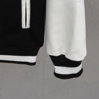 Givenchy jacket hem and sleeve cuff in black with ribbed white-and-black trim