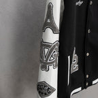 Givenchy jacket sleeve detail with white panel and gray logo applique across arm