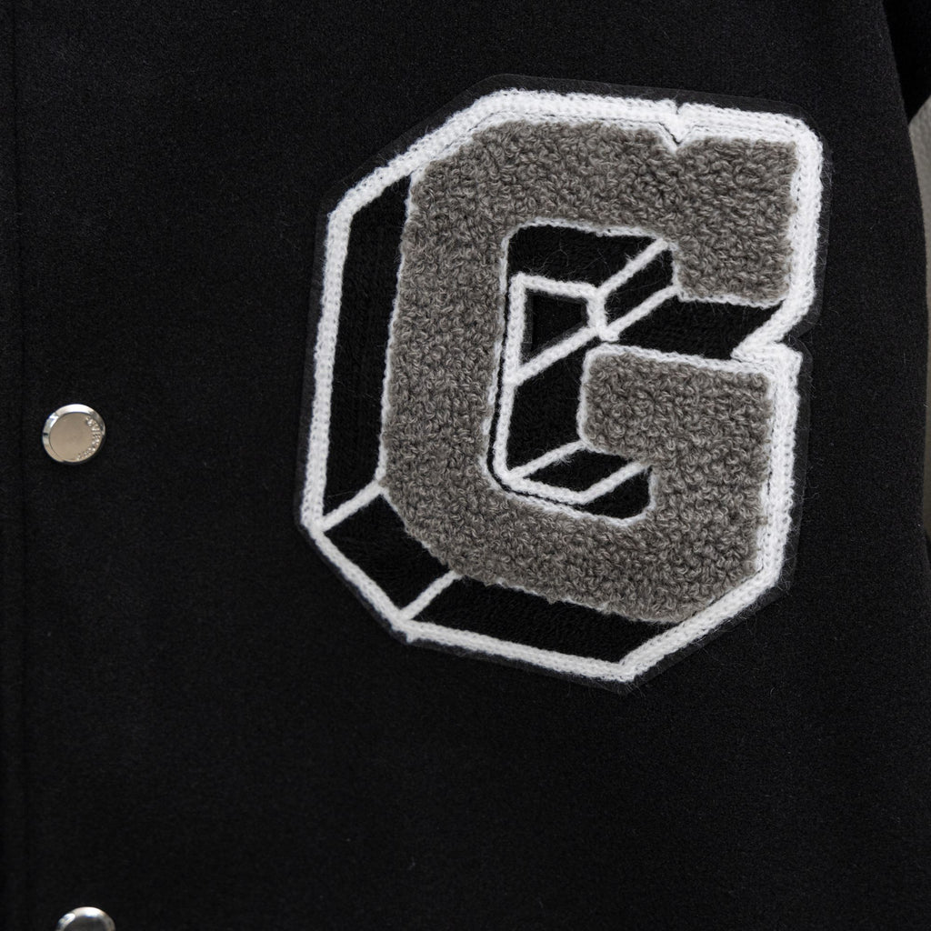 Givenchy jacket pocket patch in gray applique with white outline and button closure