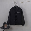 Dior long jacket in dark knit with button front and small chest logo