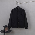 Dior long jacket in dark knit with button front and small chest logo