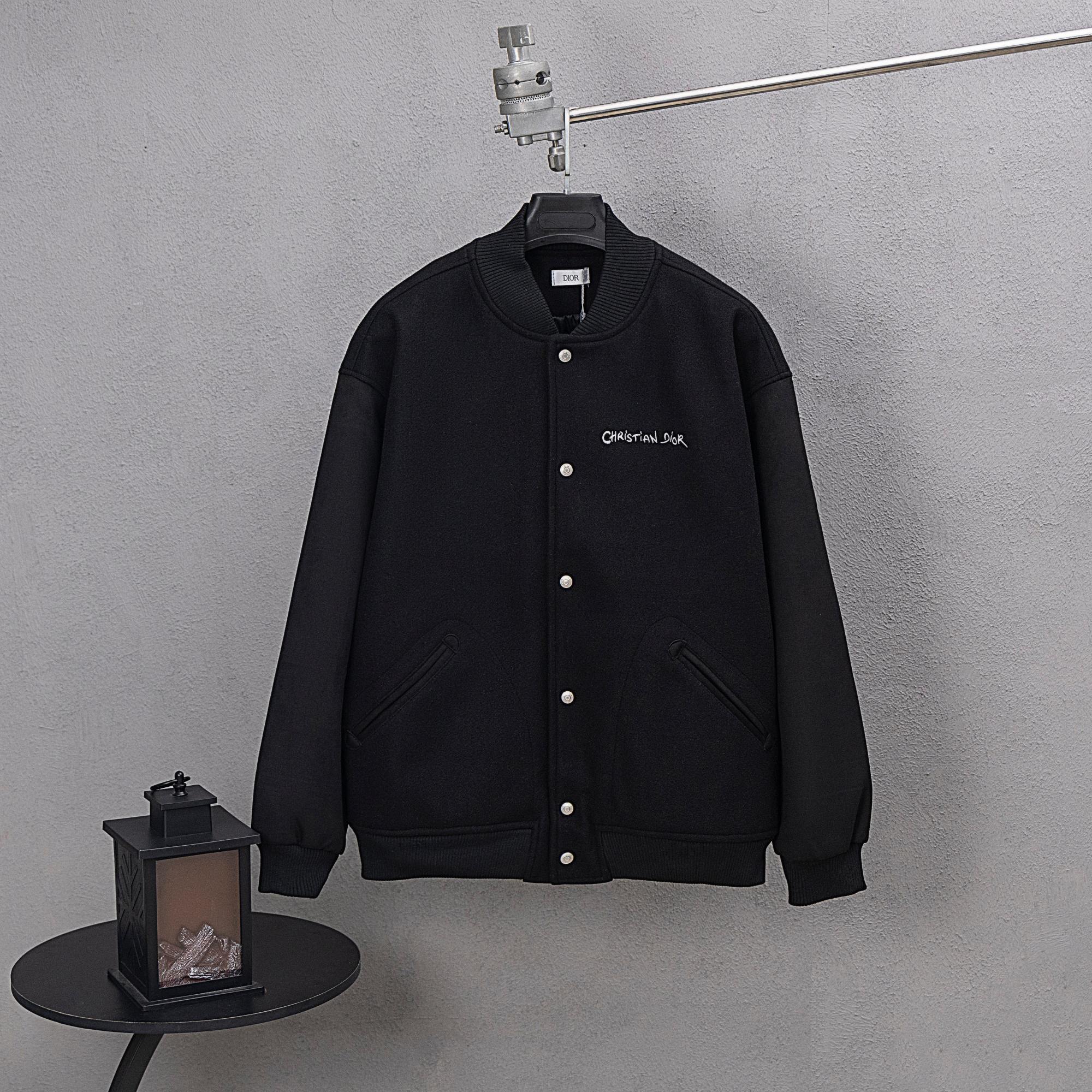 Dior long jacket in dark knit with button front and small chest logo
