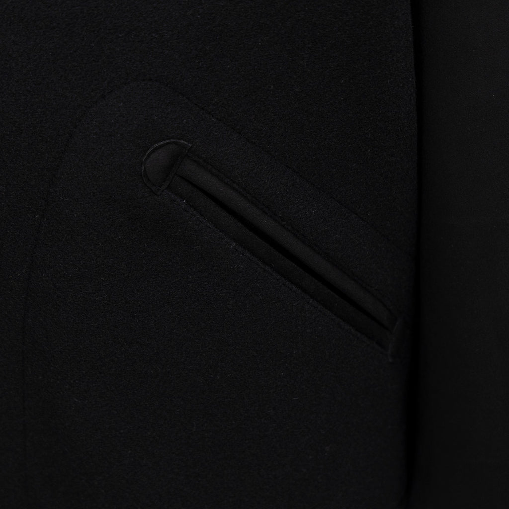 Long jacket side pocket with welt detailing in dark fabric