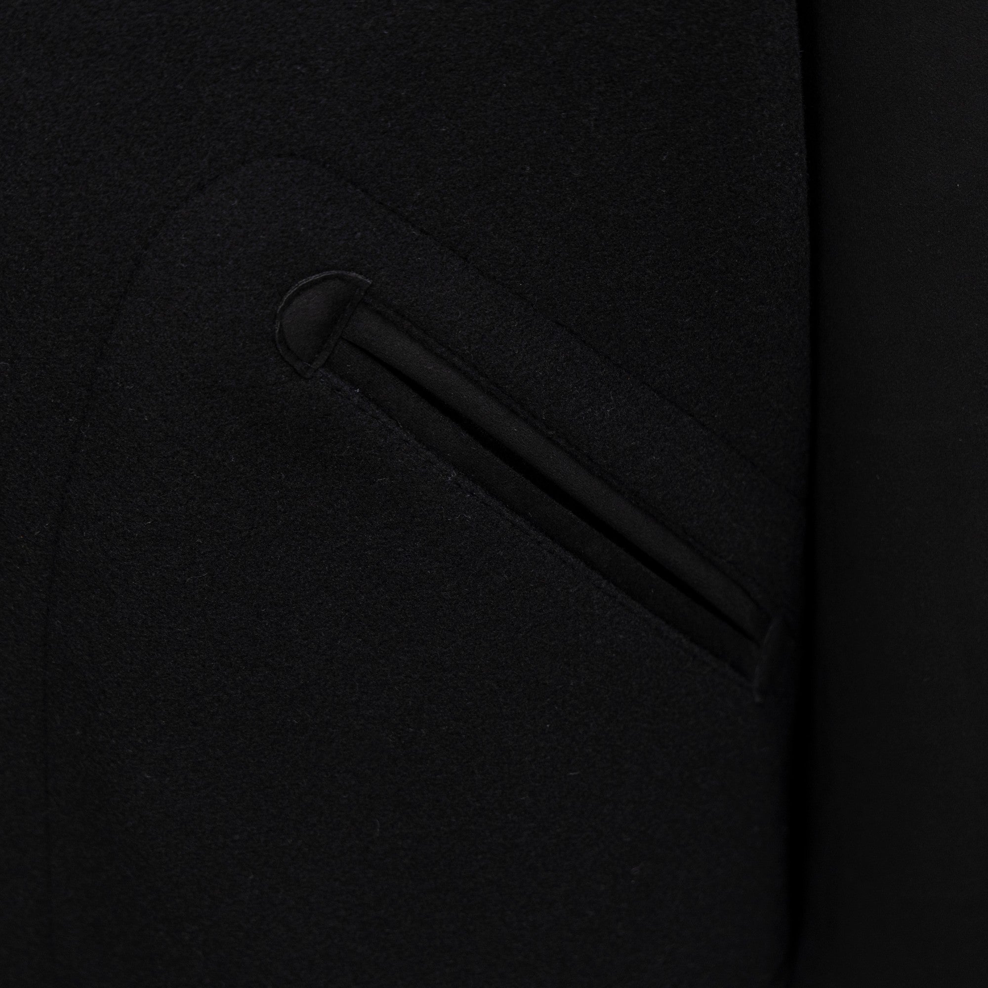 Long jacket side pocket with welt detailing in dark fabric