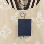 Louis Vuitton jacket front, cream fabric with button placket and round metal snap