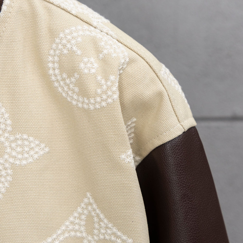 Louis Vuitton jacket shoulder, cream textured fabric with brown leather sleeve panel