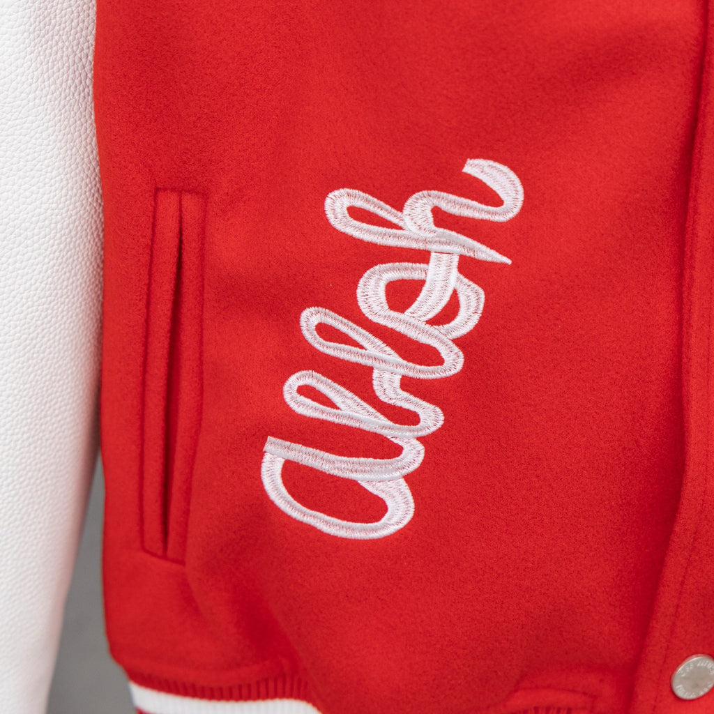 Red sweatshirt with large white script logo and front pocket