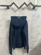 Dark navy zip-up hoodie with hood and small embroidered logo on the back