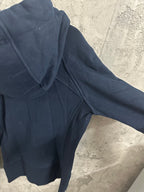 Dark navy zip-up hoodie close-up of hood and shoulder seam with zipper edge