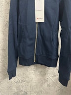 Dark navy zip-up hoodie with gold-toned zipper, hood, and front kangaroo pocket