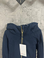 Dark navy zip-up hoodie with gold-toned zipper and adjustable drawstring hood