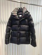 Puffer jacket with plaid hood lining, dark exterior, zip-front and padded design