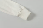 White jacket sleeve cuff with ribbed hem detail