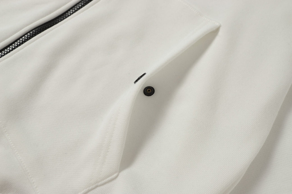 White hooded jacket front with button closure near chest pocket