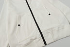 White hooded jacket showing two front flap pockets and black zipper