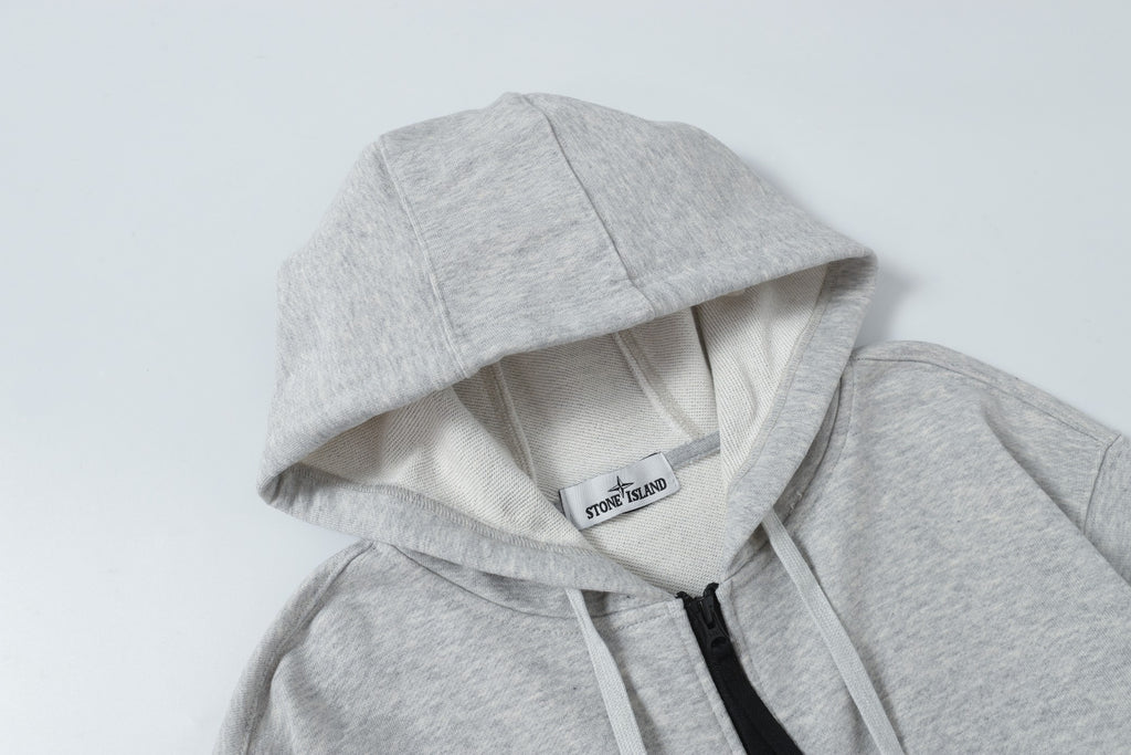 Light gray zip hoodie with hood lining and black zipper trim at front