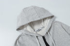 Light gray zip hoodie with hood lining and black zipper trim at front
