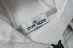 Light gray hoodie neckline with Stone Island logo fabric label