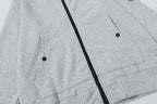 Light gray zip hoodie front with two pockets and black zipper