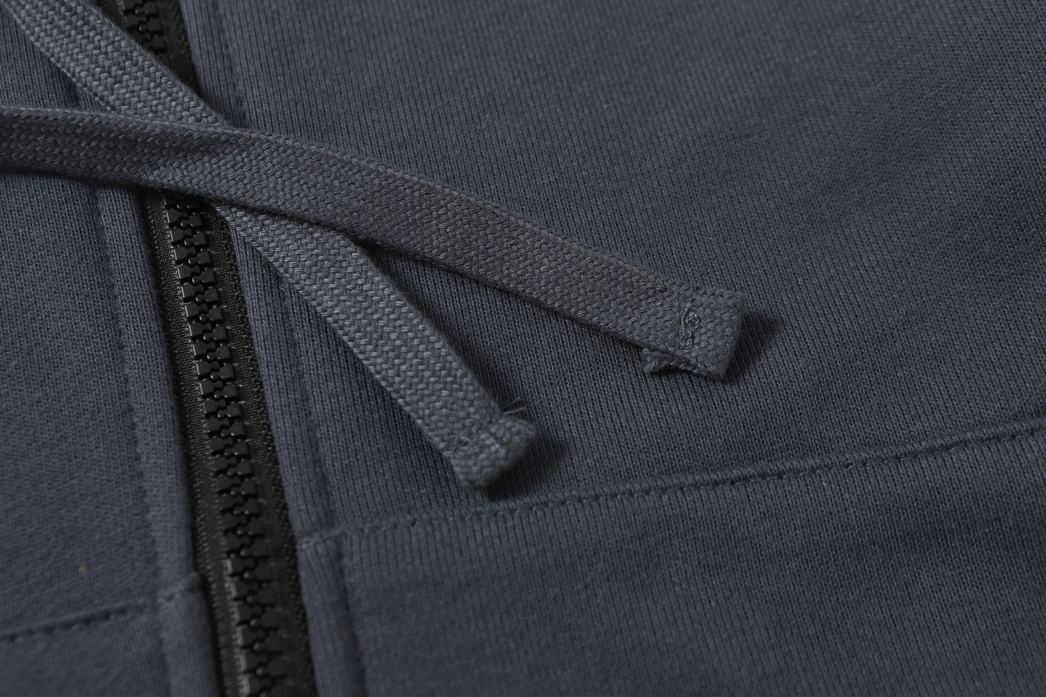 Stone Island hooded zip jacket drawstring and dark navy zipper placket