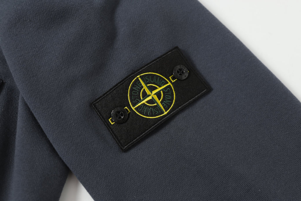 Stone Island label patch on dark navy knit sleeve