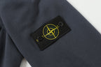 Stone Island label patch on dark navy knit sleeve