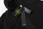 Black hooded zip jacket close-up of hood patch and care label