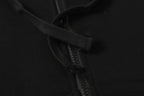 Black hooded jacket zipper and drawstring close-up