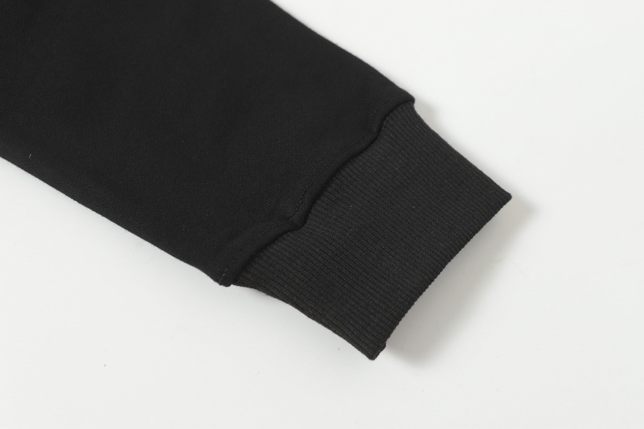 Black ribbed sleeve cuff detail on hooded zip jacket