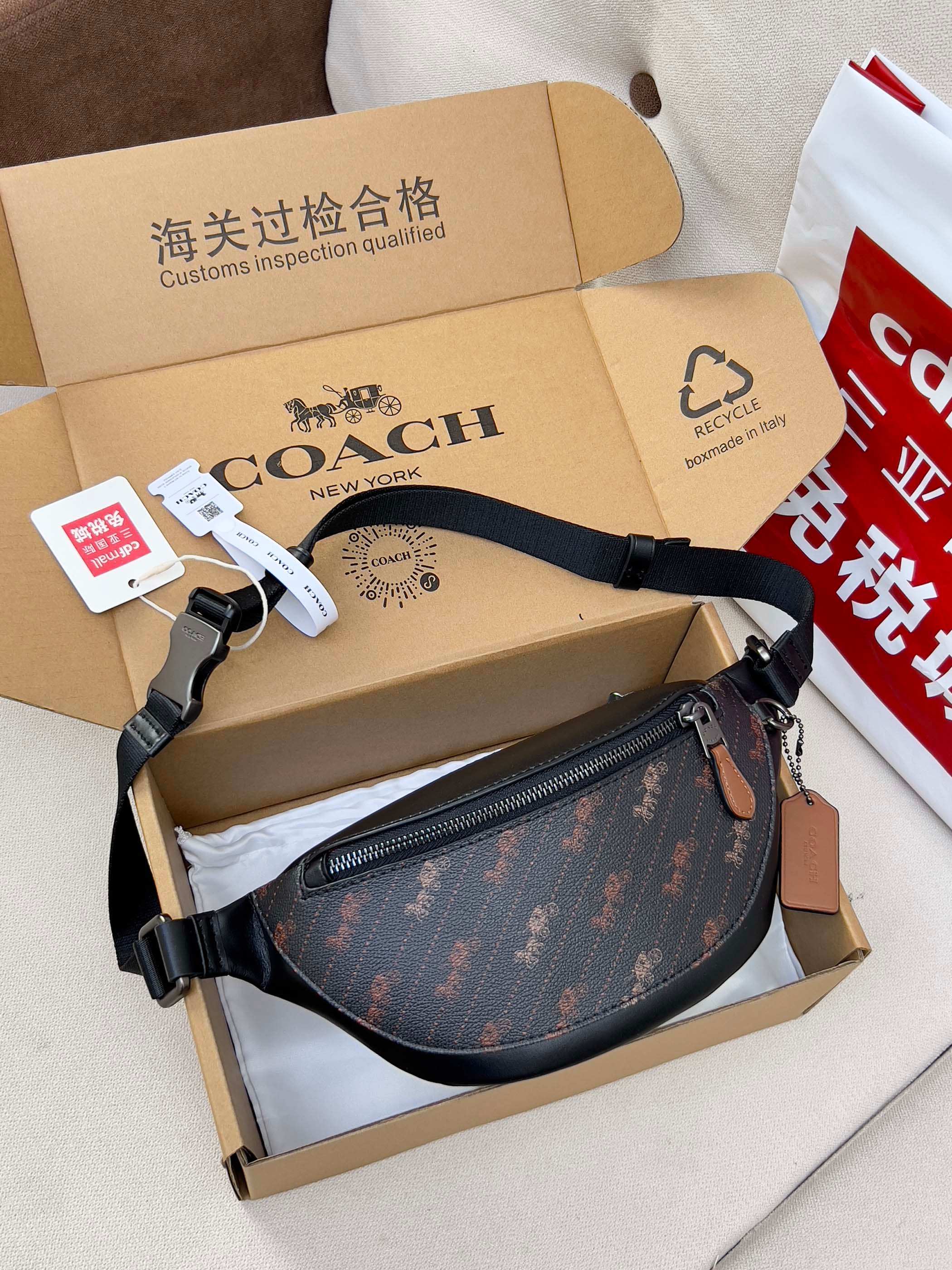 Coah crossbody waist bag, dark patterned fabric with zip pocket and adjustable strap