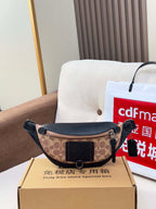 Coah monogram belt bag with black leather panels and adjustable strap