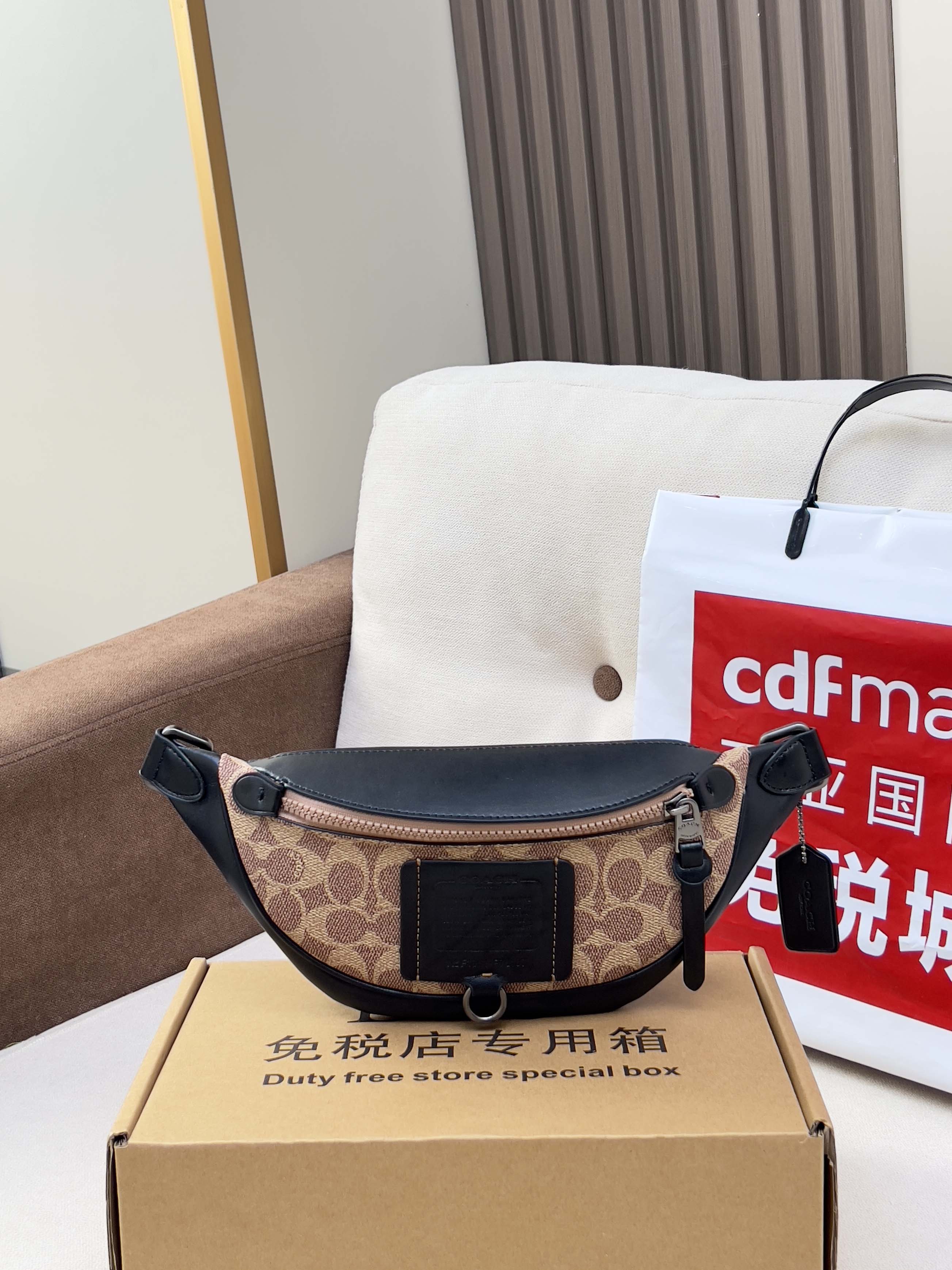 Coah monogram belt bag with black leather panels and adjustable strap