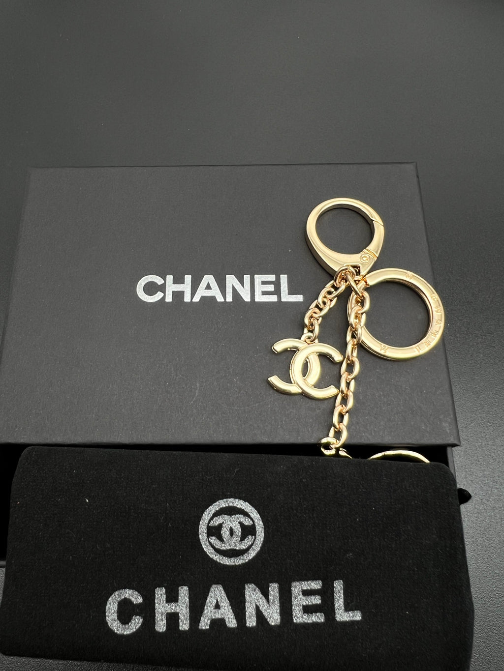 Chanel charm keychain, gold-toned key ring with charm and chain