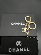 Chanel charm keychain, gold-toned key ring with charm and chain
