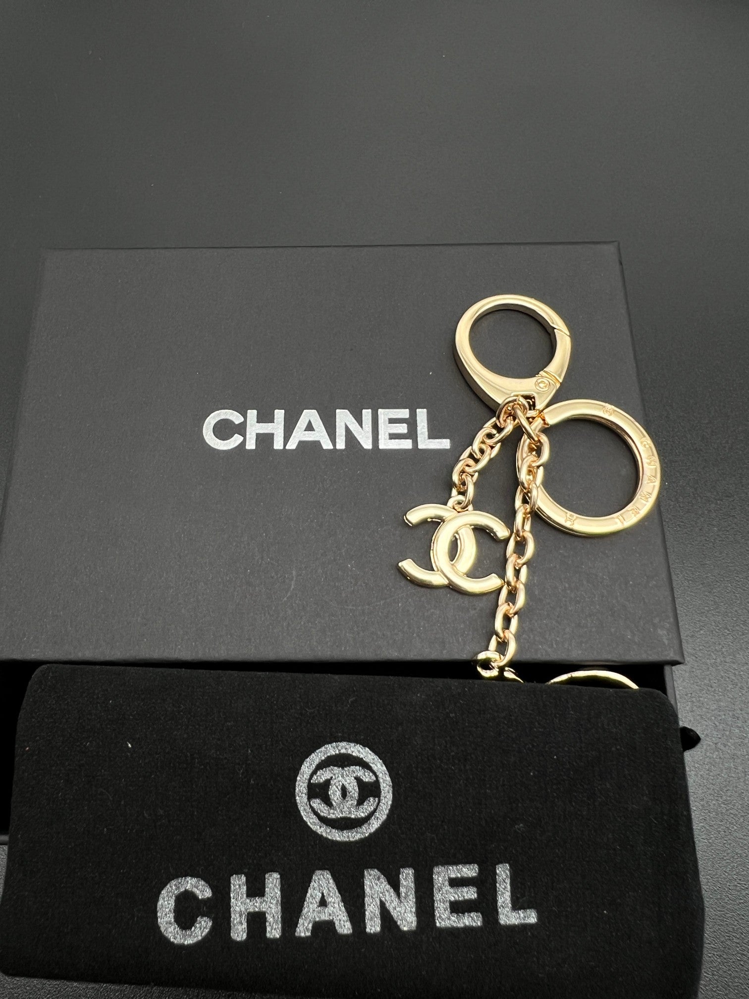 Chanel charm keychain, gold-toned key ring with charm and chain