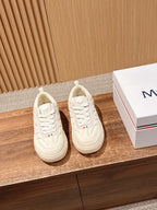 Moncler luxury shoes in cream leather-look, lace-up design with logo detail.