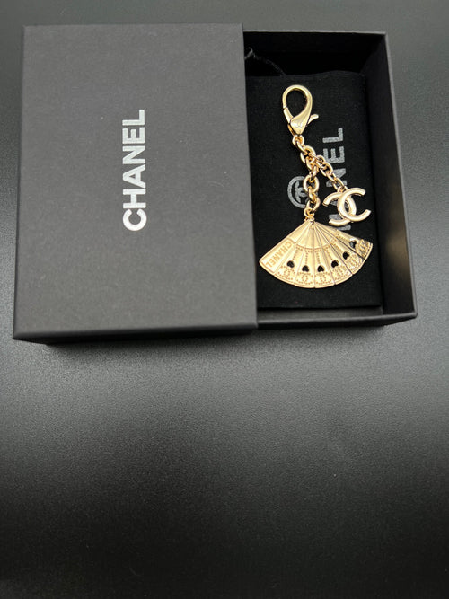 Chanel gold fan charm with chain and clasp in black gift box