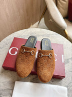 Gucci unisex tan GG mules with gold-tone horsebit detail