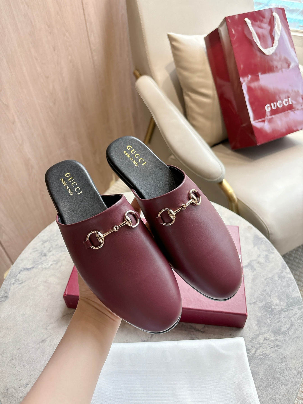 Burgundy leather mule loafers with gold horsebit detail and cushioned footbeds