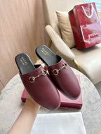 Burgundy leather mule loafers with gold horsebit detail and cushioned footbeds