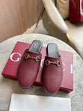 Burgundy leather mule loafers with gold-tone horsebit detail and black insoles