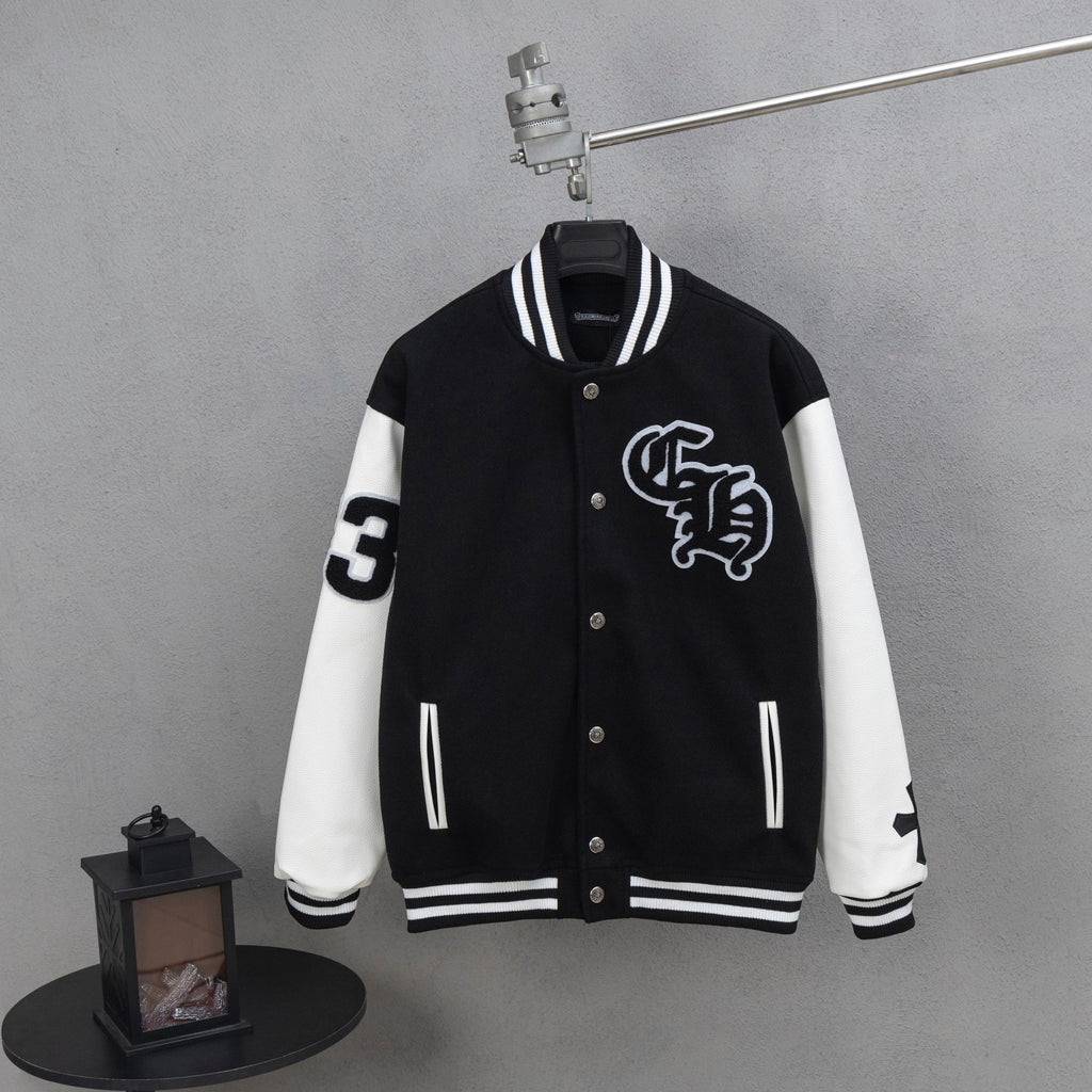 Black and white varsity jacket with snap buttons and ribbed striped cuffs
